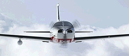 A PA46 Mirage flys above the undercast. Note the weather radar pod underneath the right wing - It is a state-of-the-art Honeywell RDR2000 color radar with a 10 inch antenna and vertical profile capability